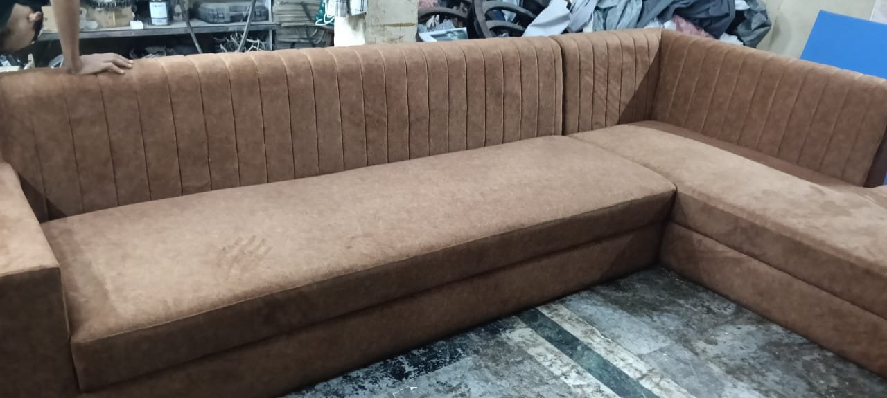 Brown channel tufted L-shaped sofa with wide seat for sofa repair and custom work in Ghaziabad